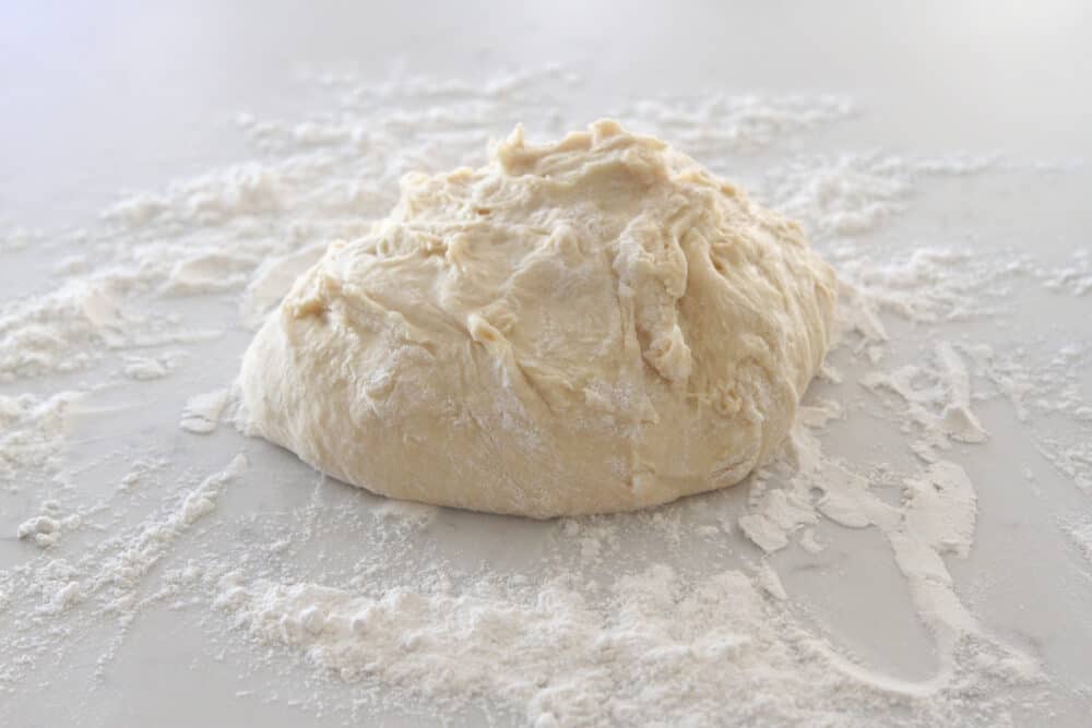 sweet rolls dough on floured countertop