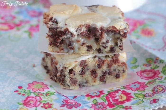 Two marshmallow chocolate chip magic bars stacked on top of one another.