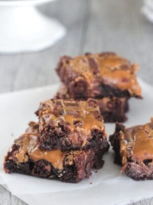 Salted caramel brownies on a napkin.