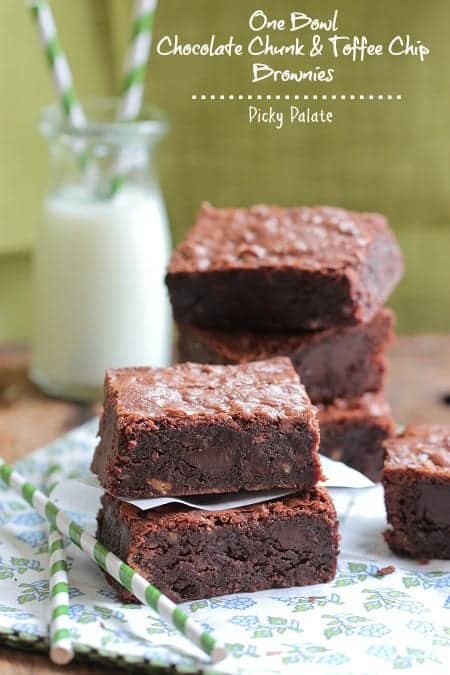 Stacks of chocolate chunk brownies next to eachother.