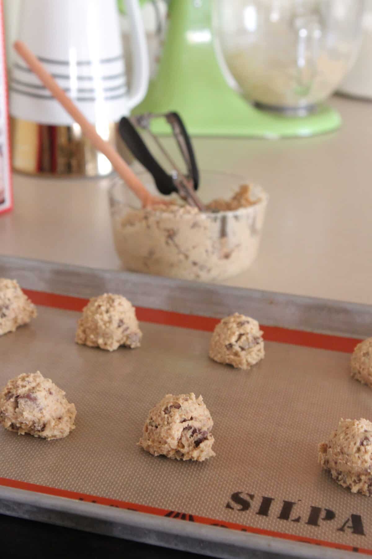 oatmeal chocolate chip cookie dough on baking sheet ready to bake