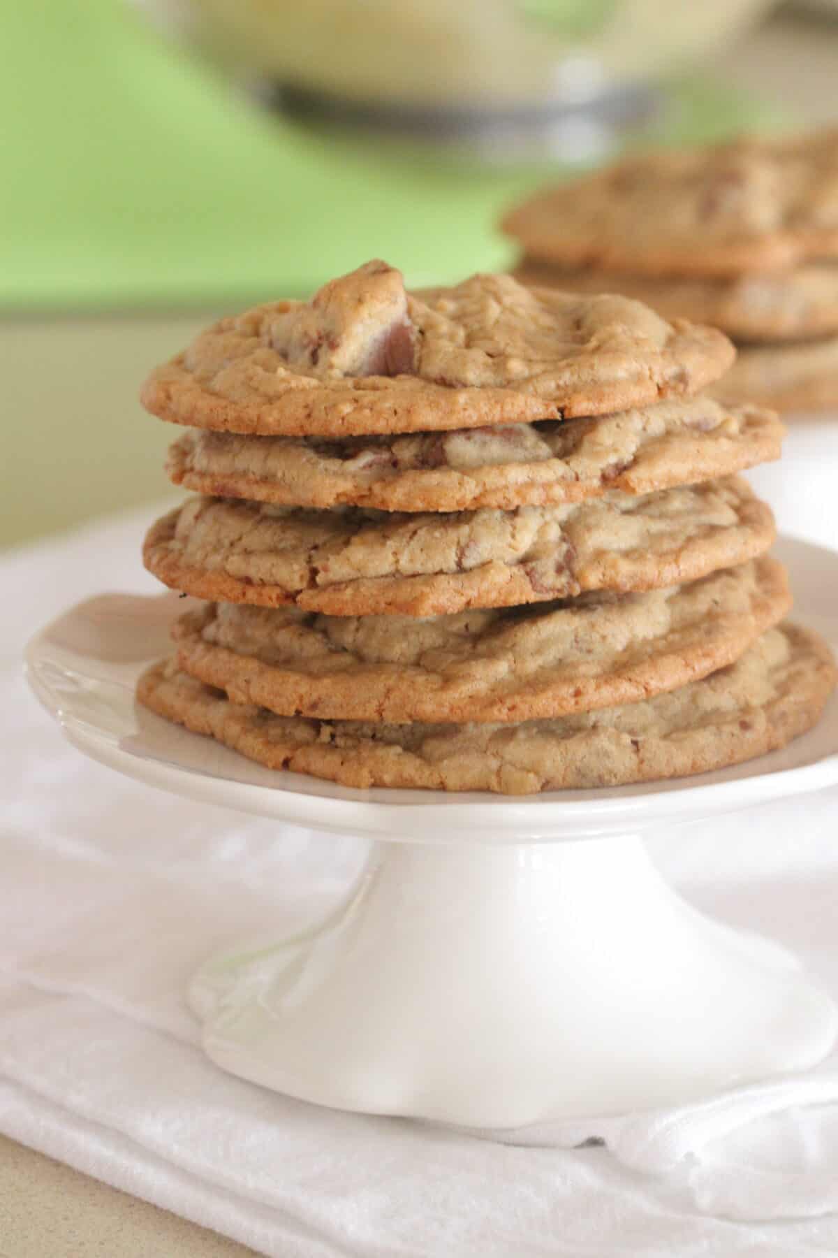 oatmeal chocolate chip cookies stacked on cake stand