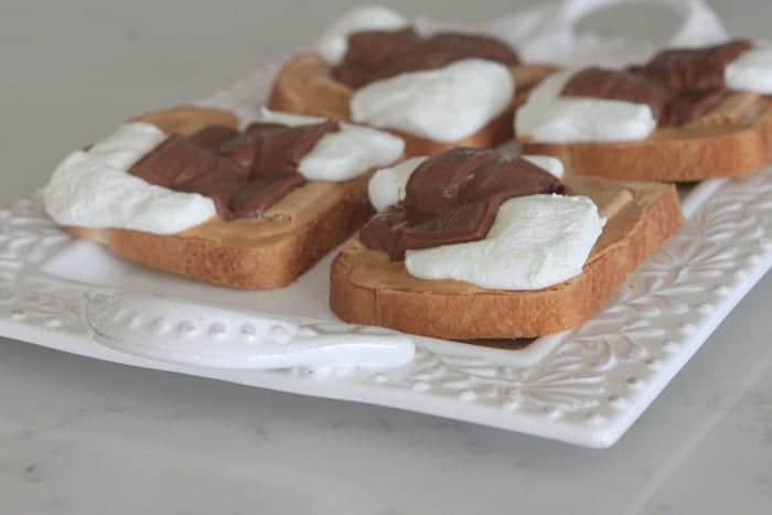 Four slices of S'mores Peanut Butter Toast on a serving platter.