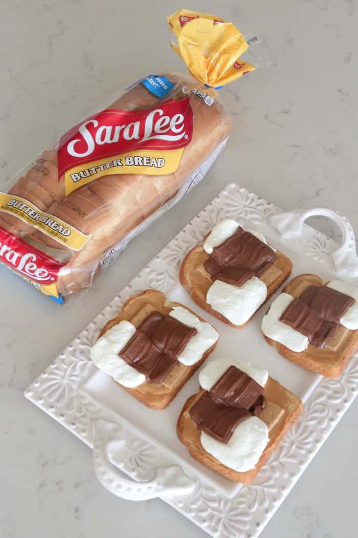 S'mores Peanut Butter Toast on a serving platter next to a loaf of Sara Lee bread.