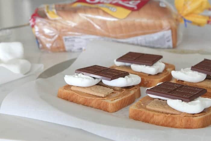 S'mores Peanut Butter Toast on a serving platter next to a loaf of Sara Lee bread.