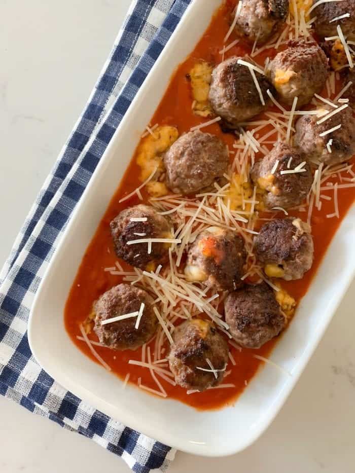 Cheddar Stuffed Homemade Meatballs on serving plate