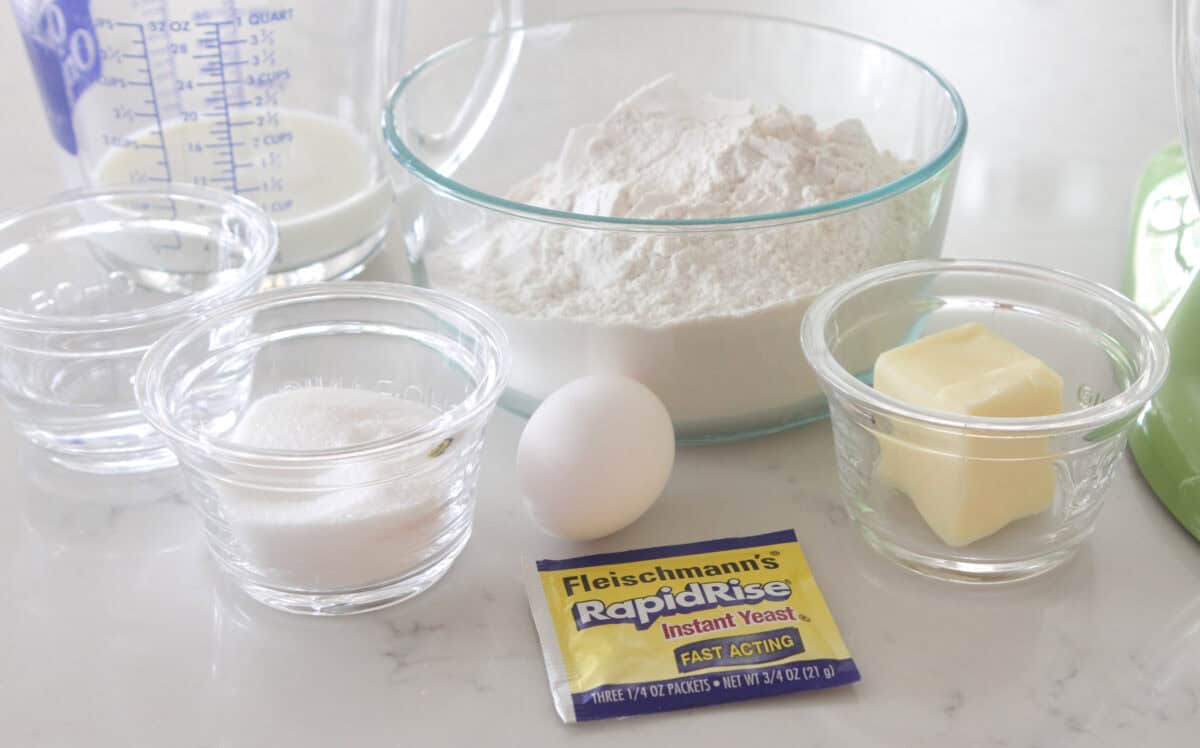 ingredients for easy cinnamon roll recipe measured out on counter