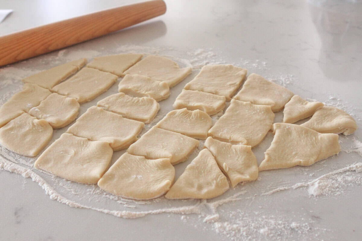 cinnamon roll dough cut into squares