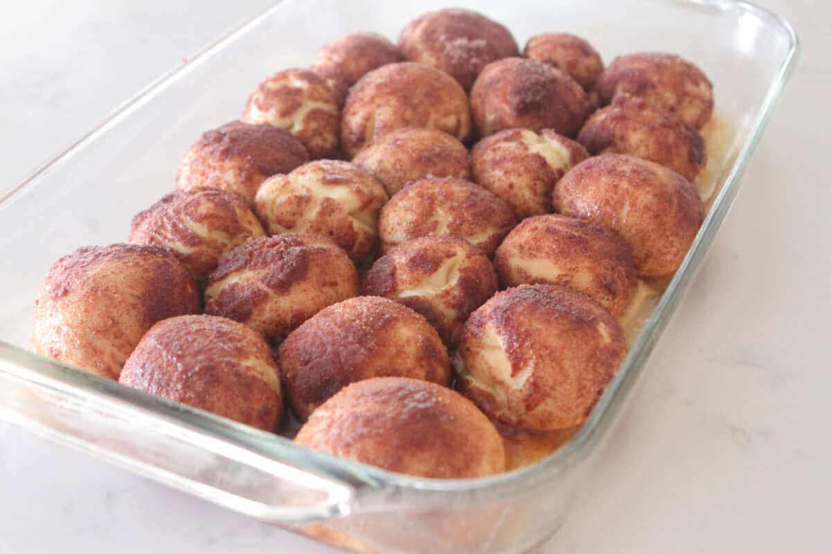 cinnamon roll bites that have rised in baking dish
