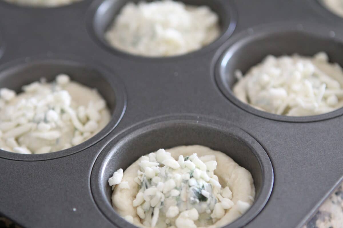 spinach dip recipe in bread bowls before baking