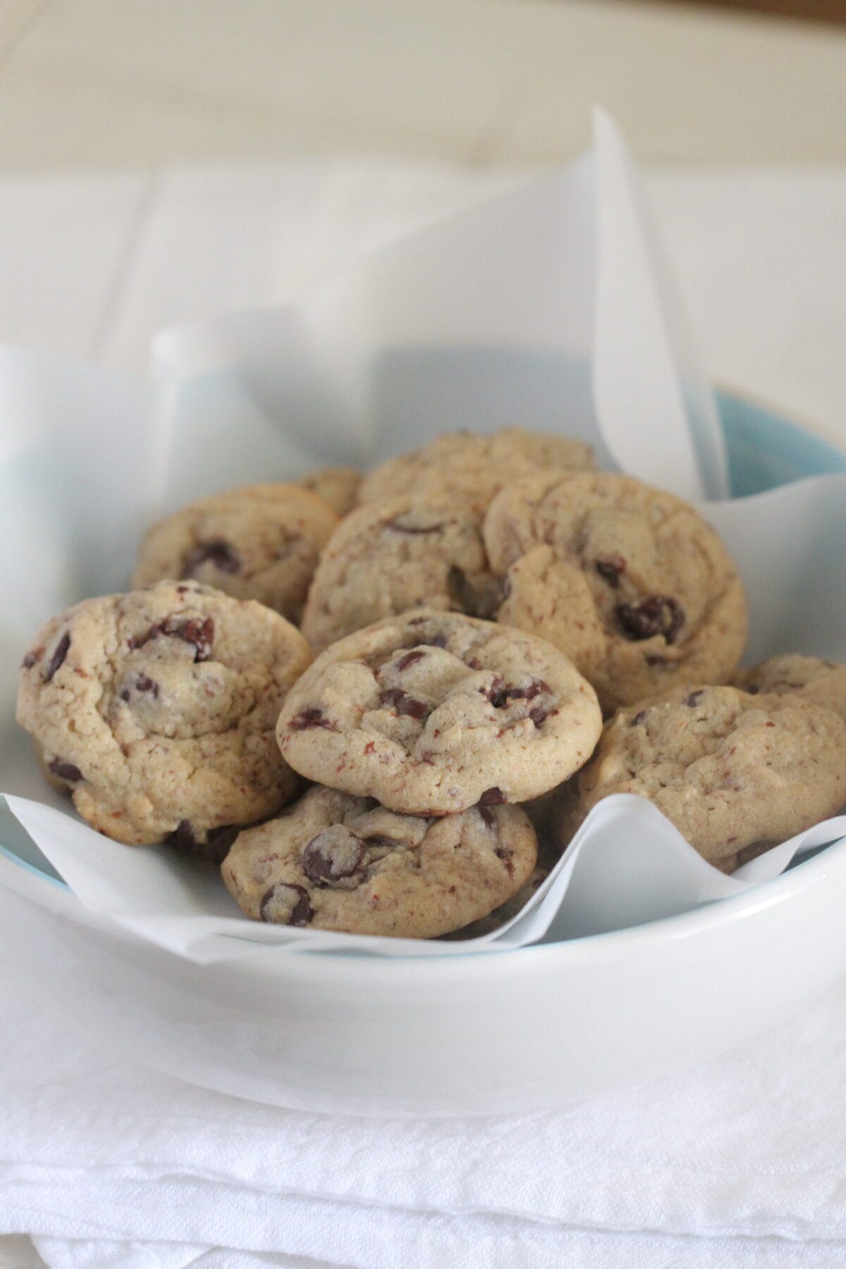 healthy chocolate chip cookies in bowl with parchment paper