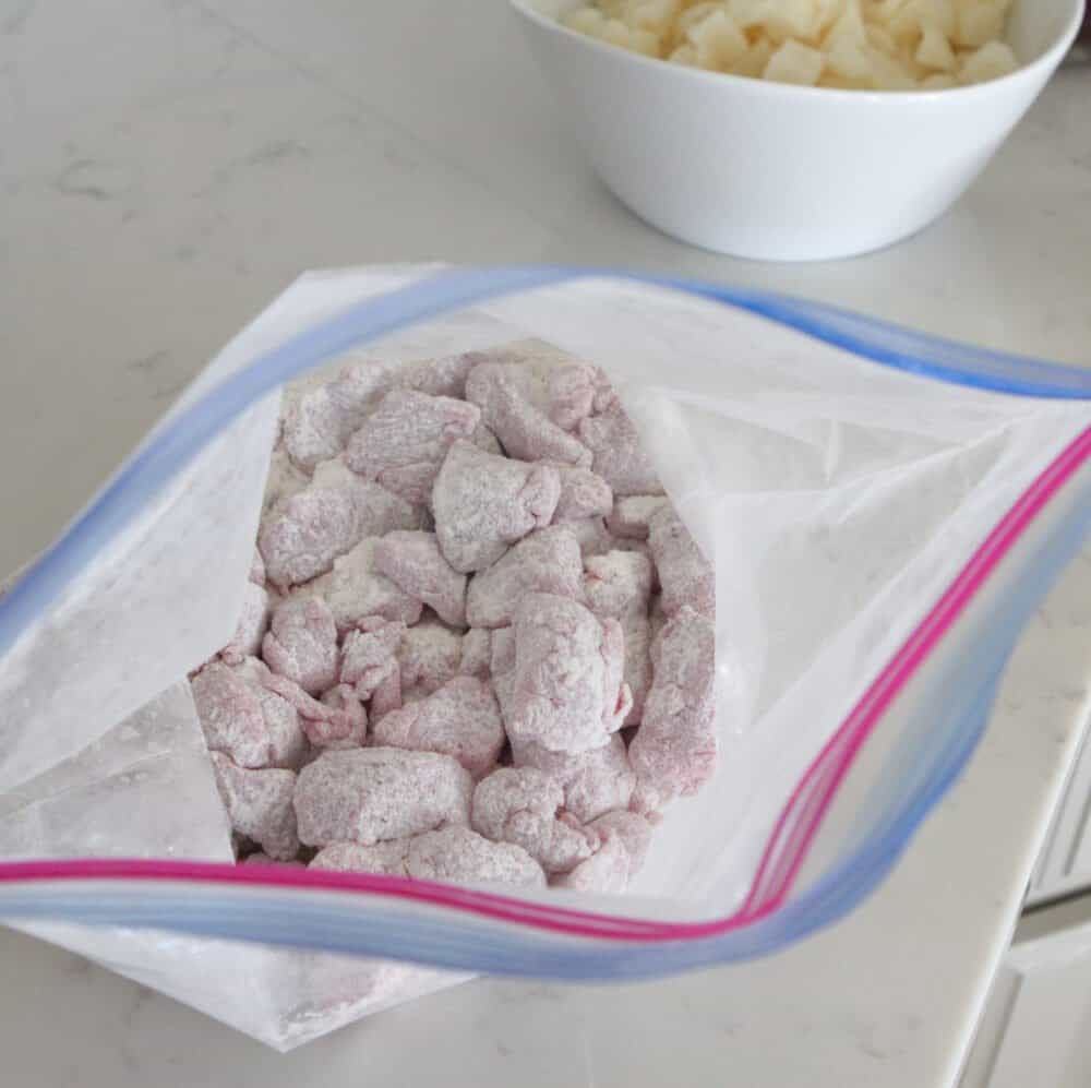 beef stew meat coated with flour in bag