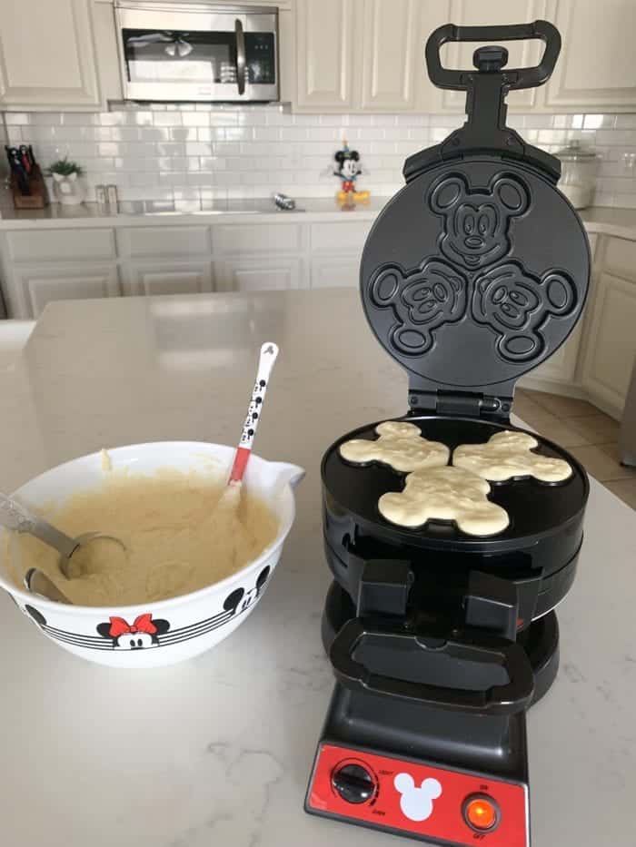 fill mickey mouse waffle maker with waffle batter