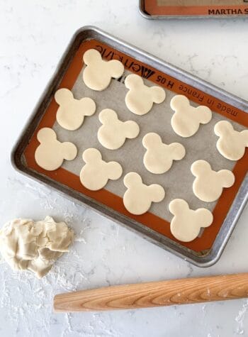 mickey mouse sugar cookies on baking sheet