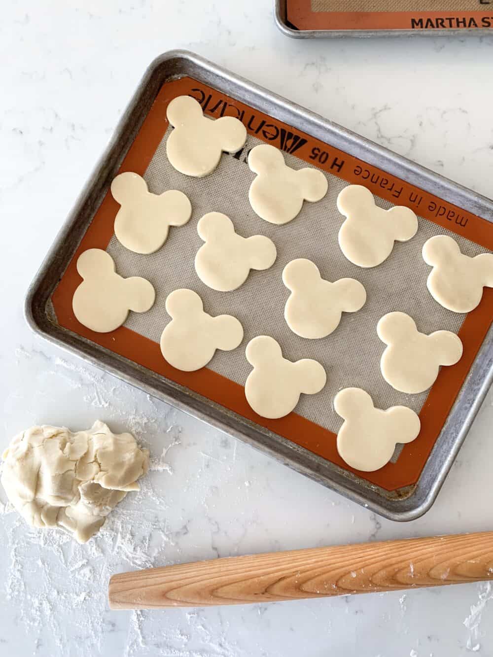 mickey mouse sugar cookies on baking sheet