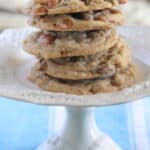 chocolate chip cookies stacked on cake stand