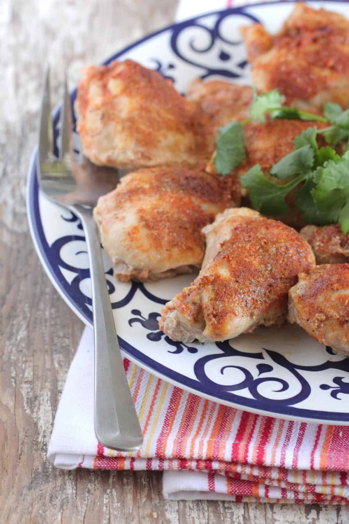 baked chicken thighs on serving plate