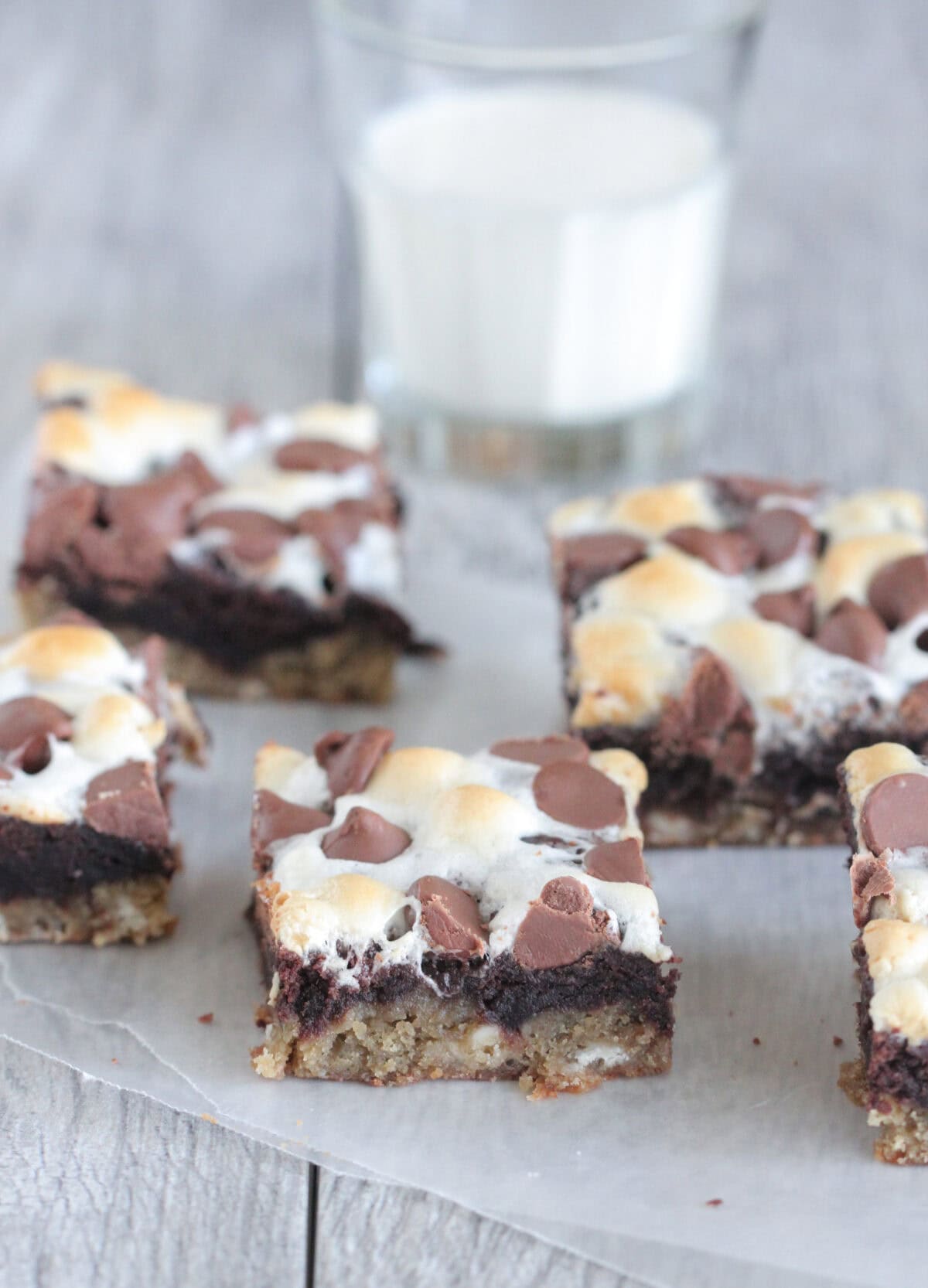 cookie bars cut into squares on parchment paper