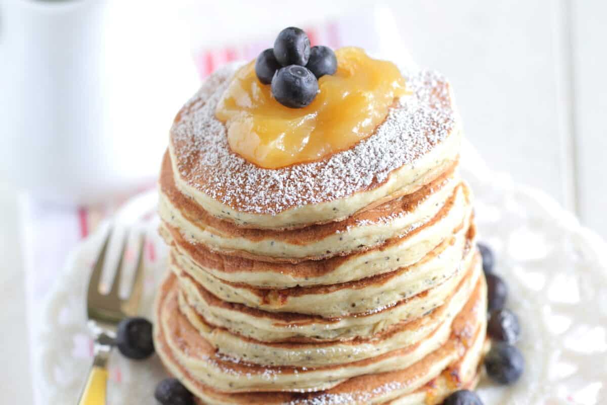 lemon ricotta pancakes stacked on plate
