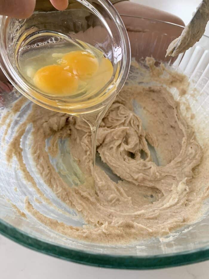 adding eggs to creamed butter and sugars