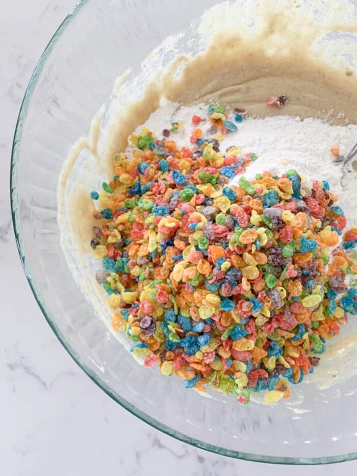 fruity pebbles in mixing bowl of cookie dough