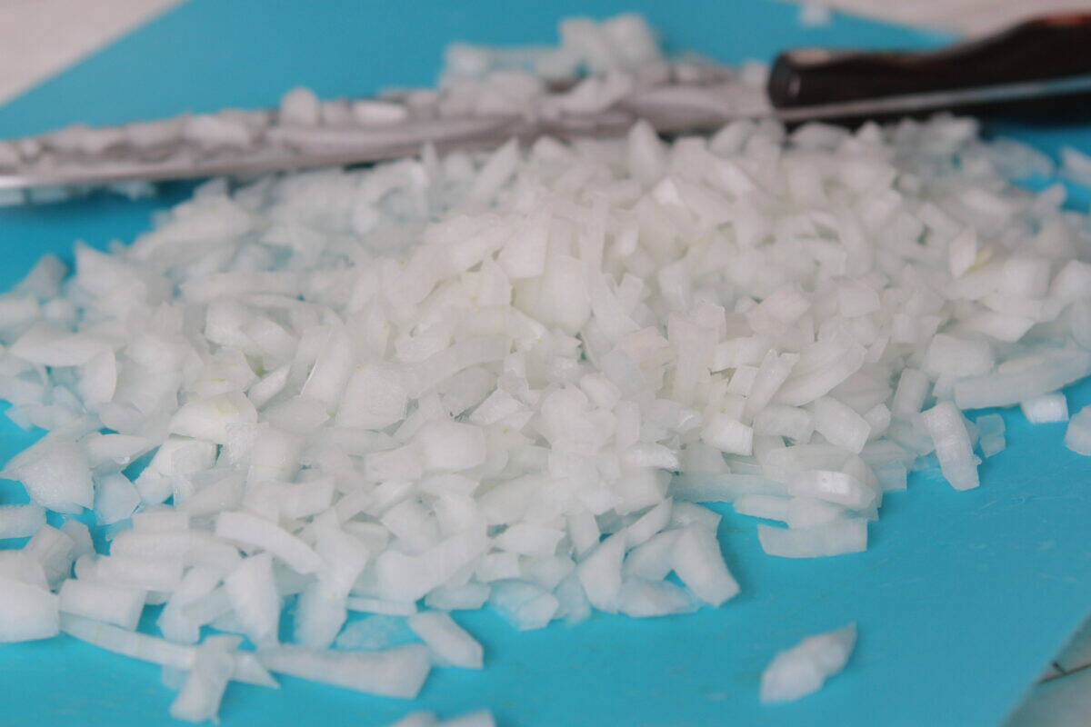 chopped onions on cutting board