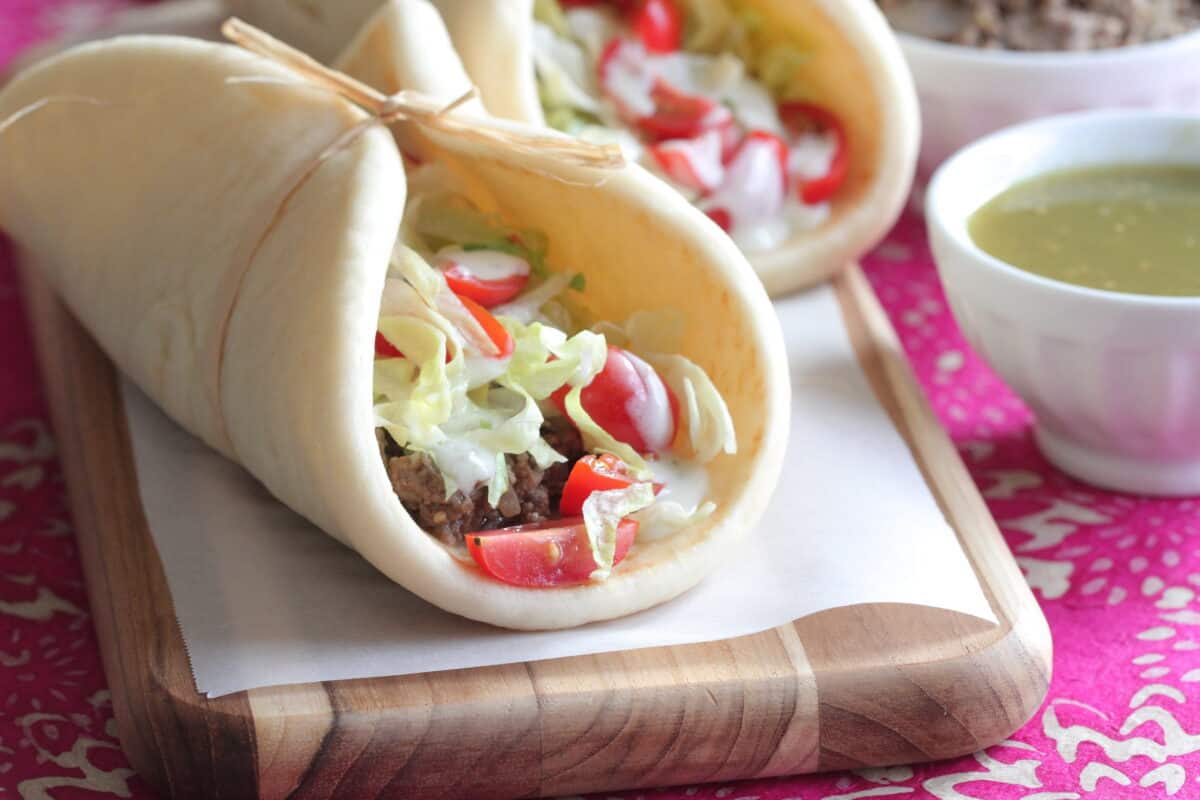 salsa verde beef tacos on serving tray