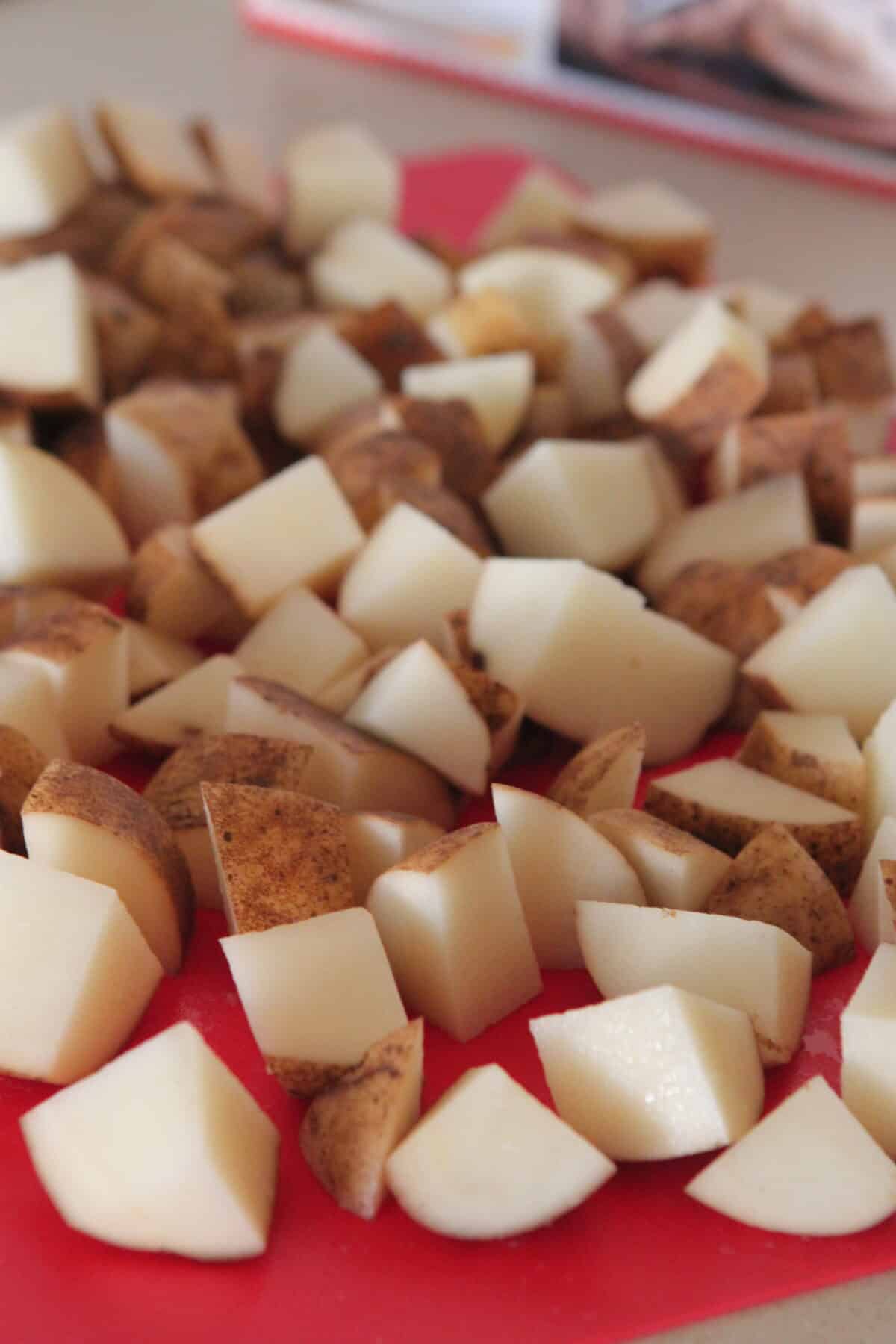 cubed potatoes on cutting board