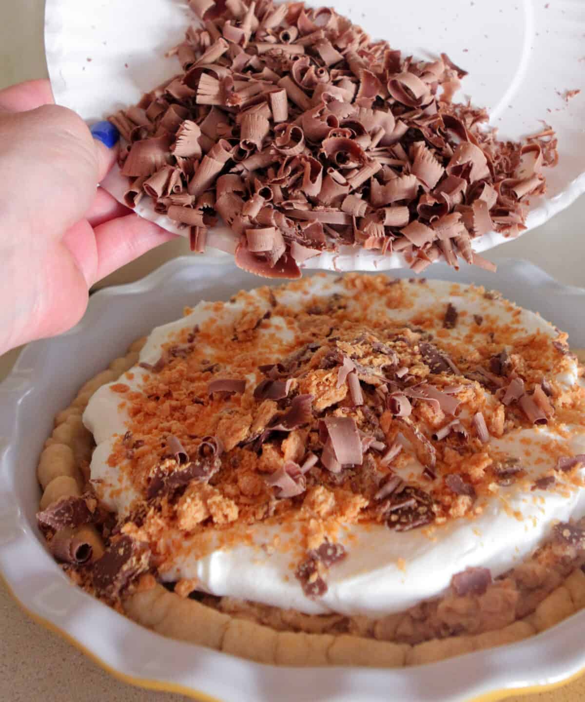 adding chocolate curls to top of pie
