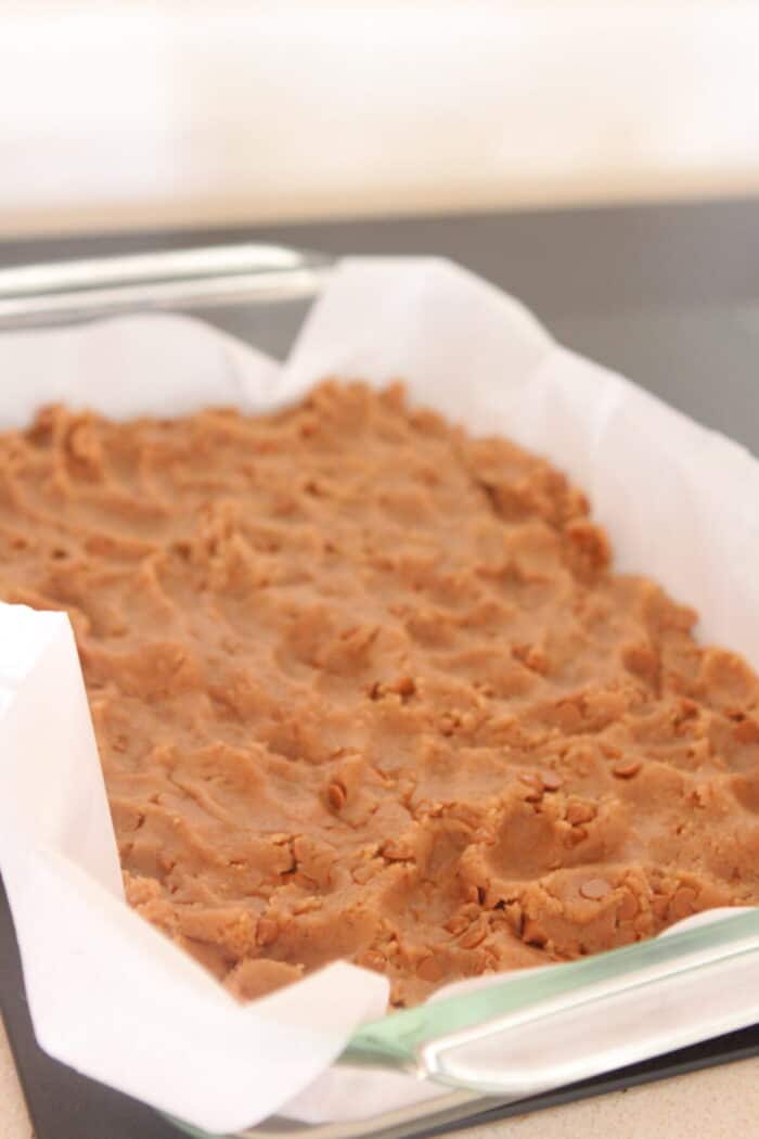 cinnamon cookie dough pressed in baking dish