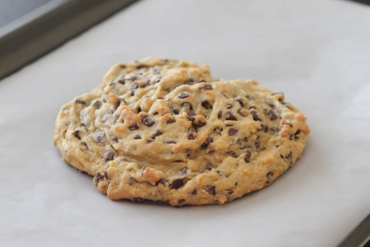 giant chocolate chip cookie baked on baking sheet