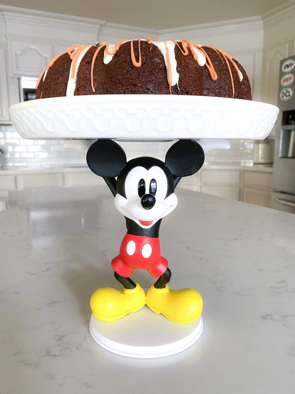 chocolate bundt cake on cake stand