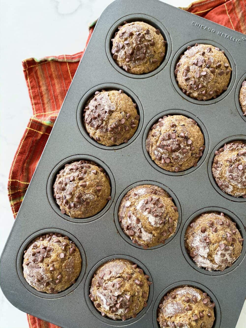 finished pumpkin chocolate chip muffins in oven ready to bake