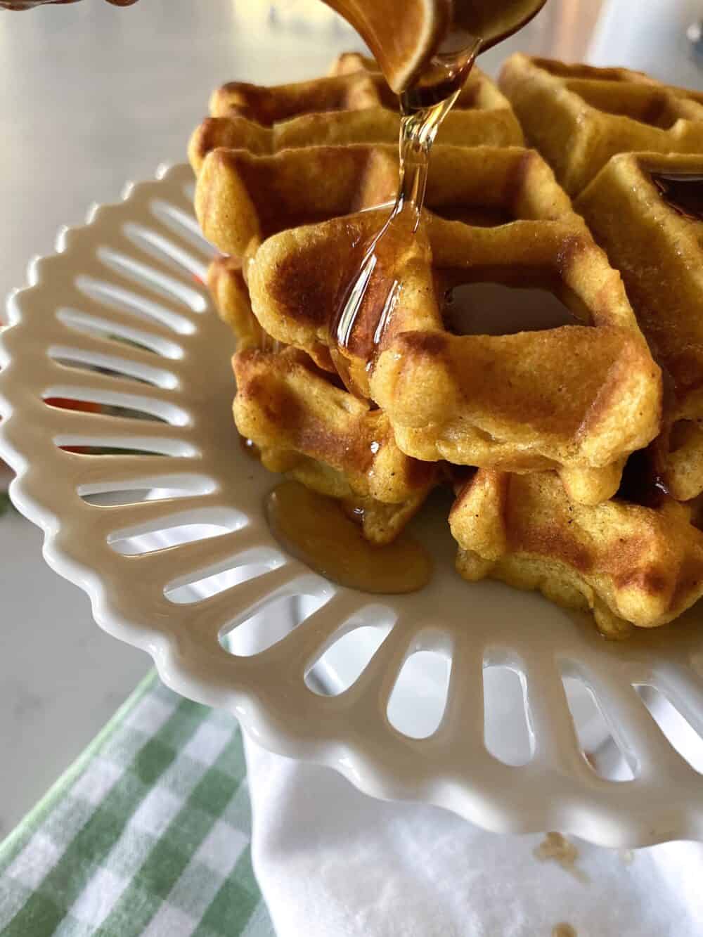pumpkin waffles drizzled with syrup