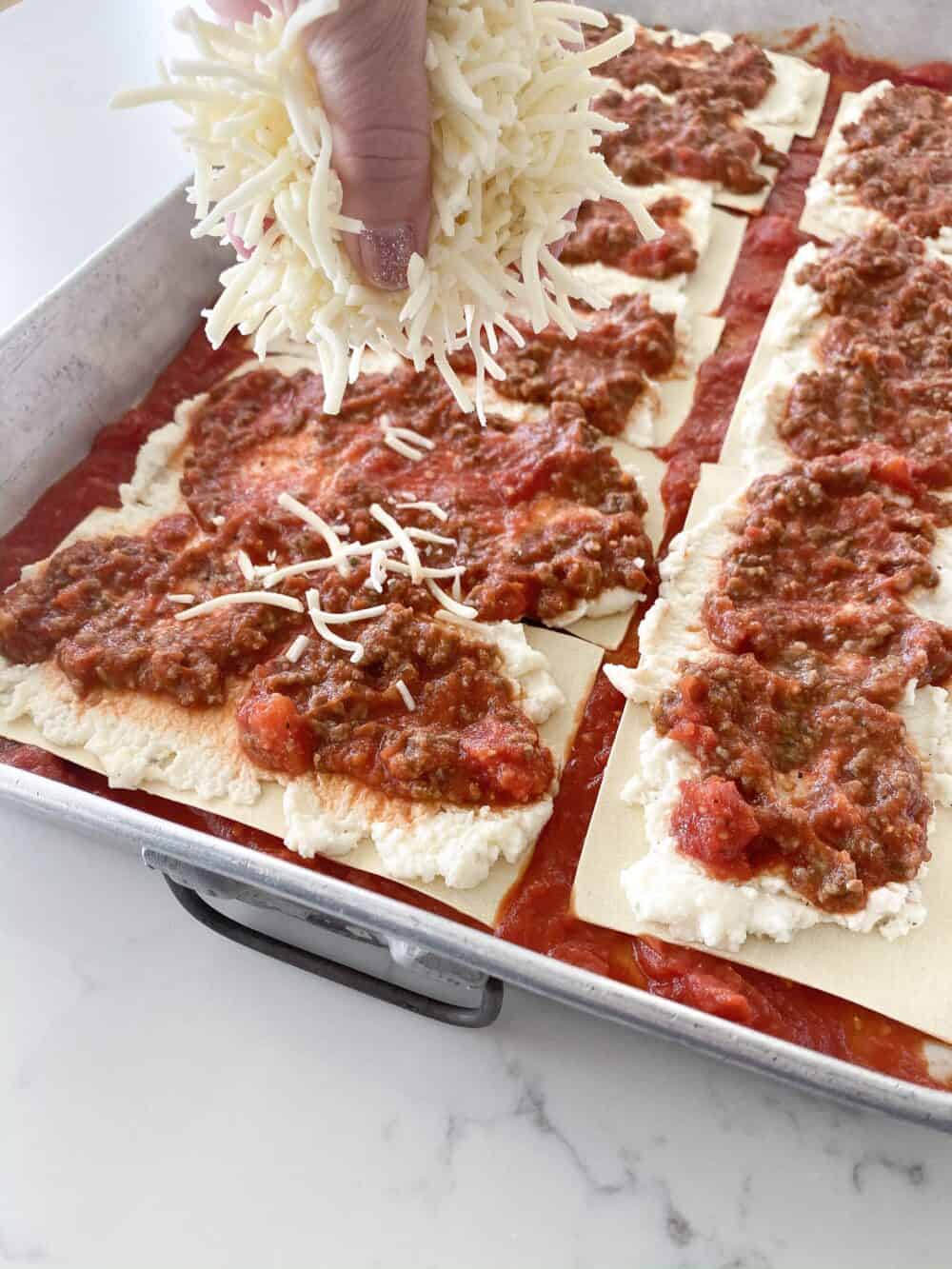 layering cheese for easy lasagna recipe