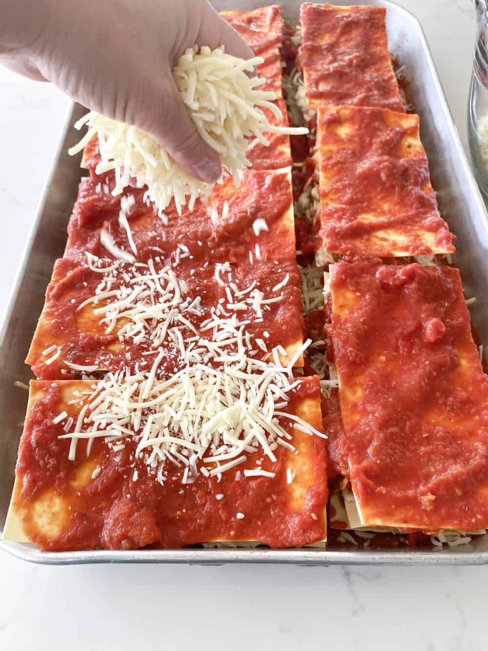 layering cheese for easy lasagna recipe