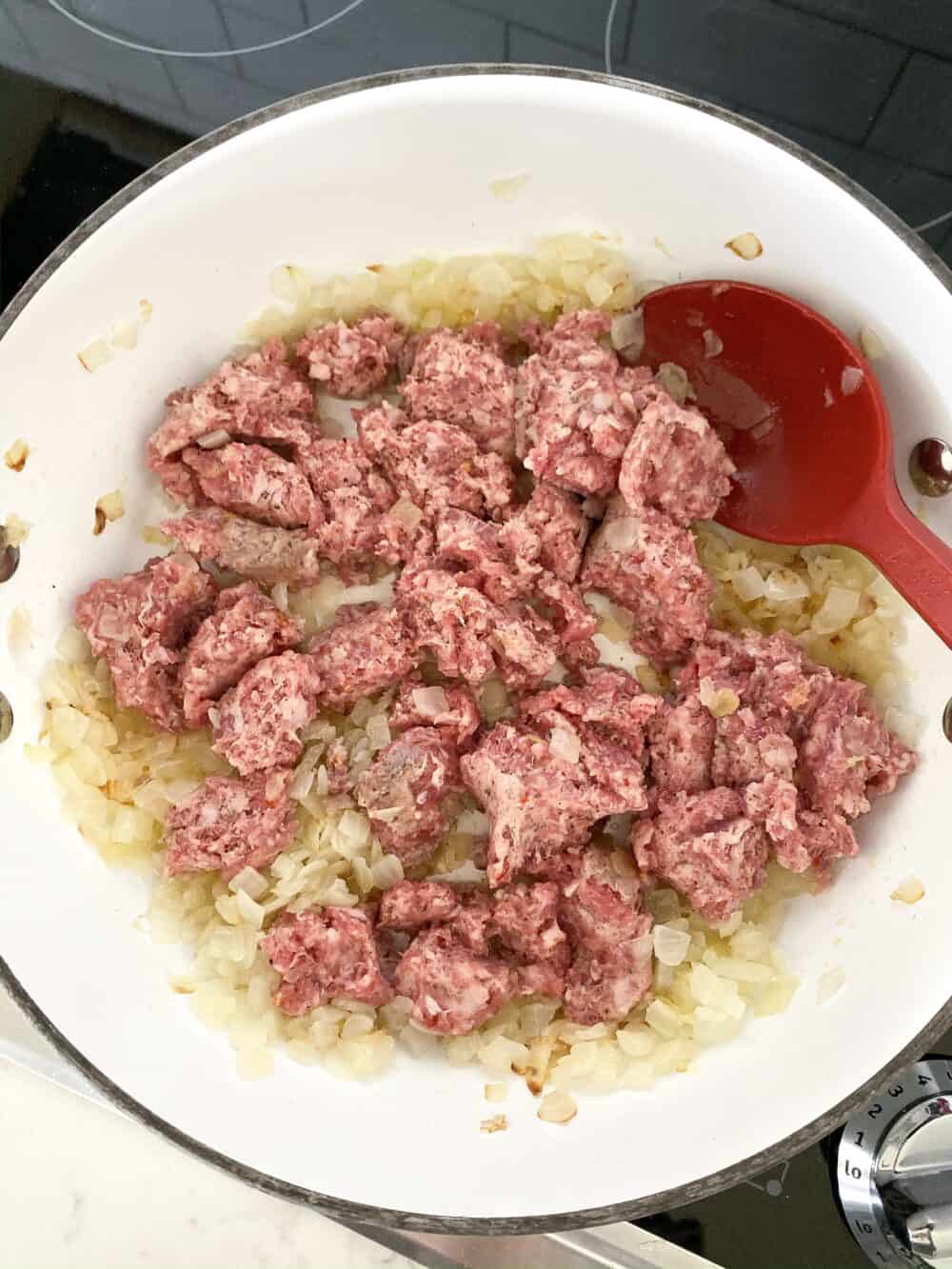 browning sausage in pot for lasagna soup