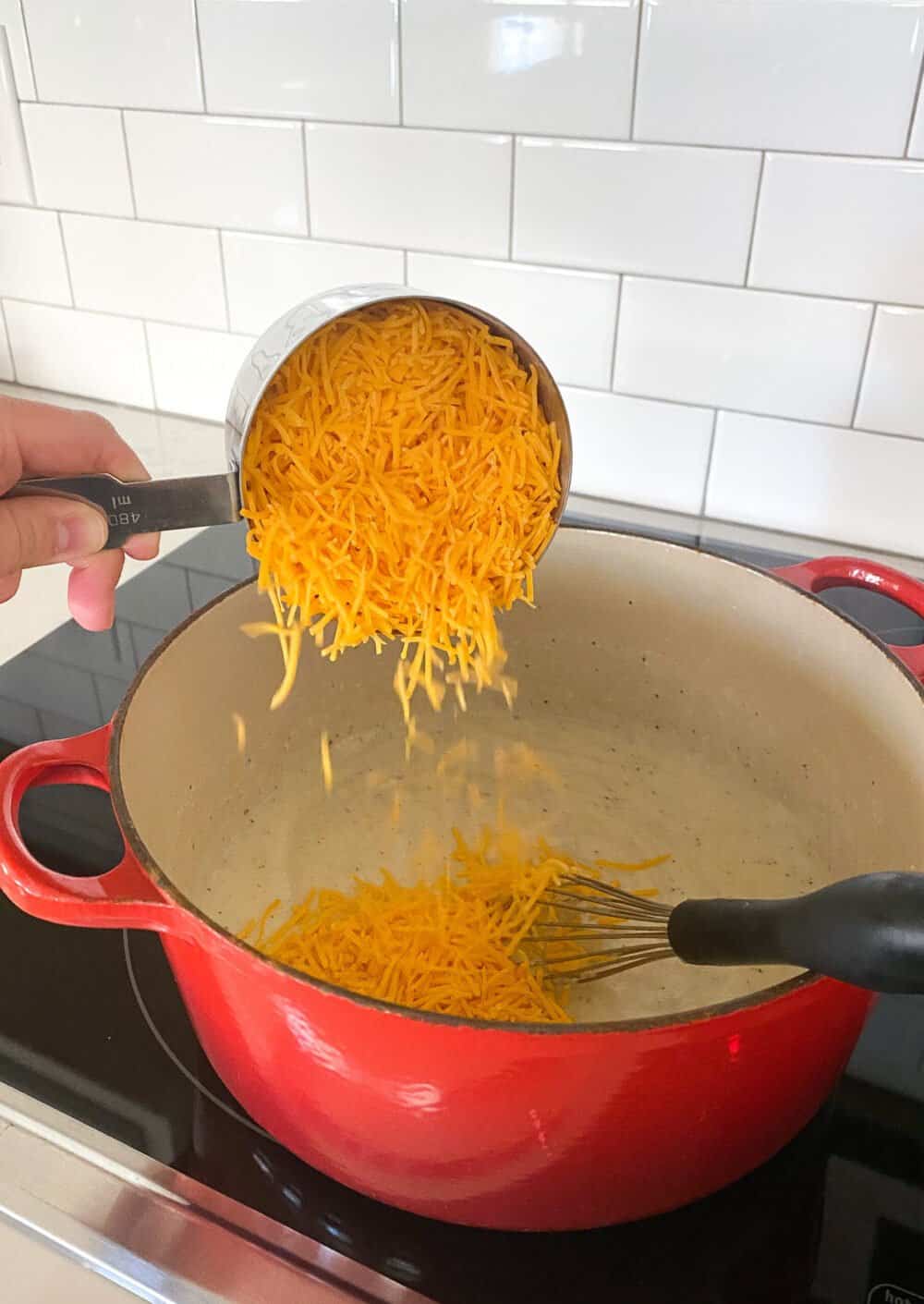 adding cheese for mac and cheese sauce