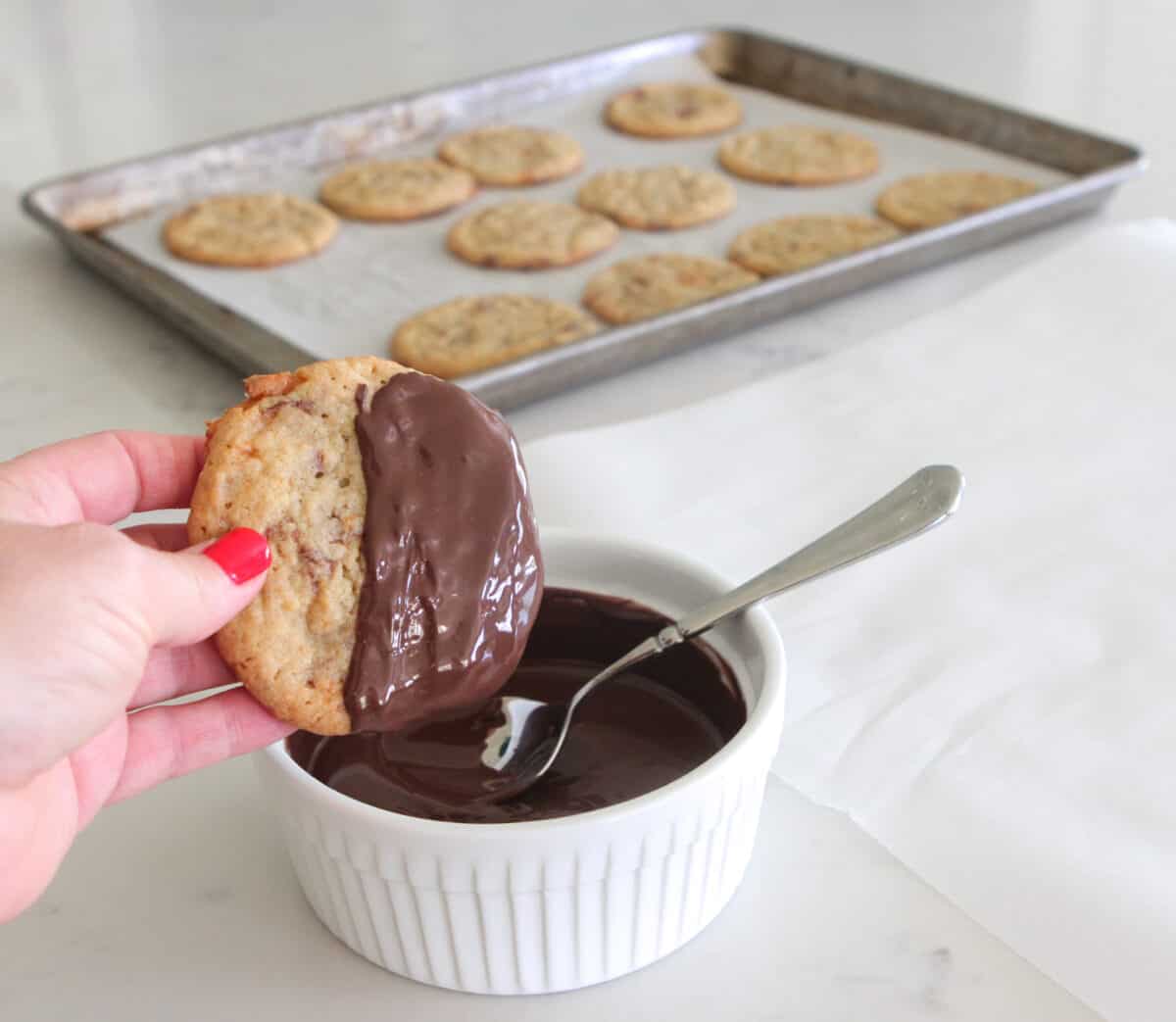 dipping cookies into chocolate
