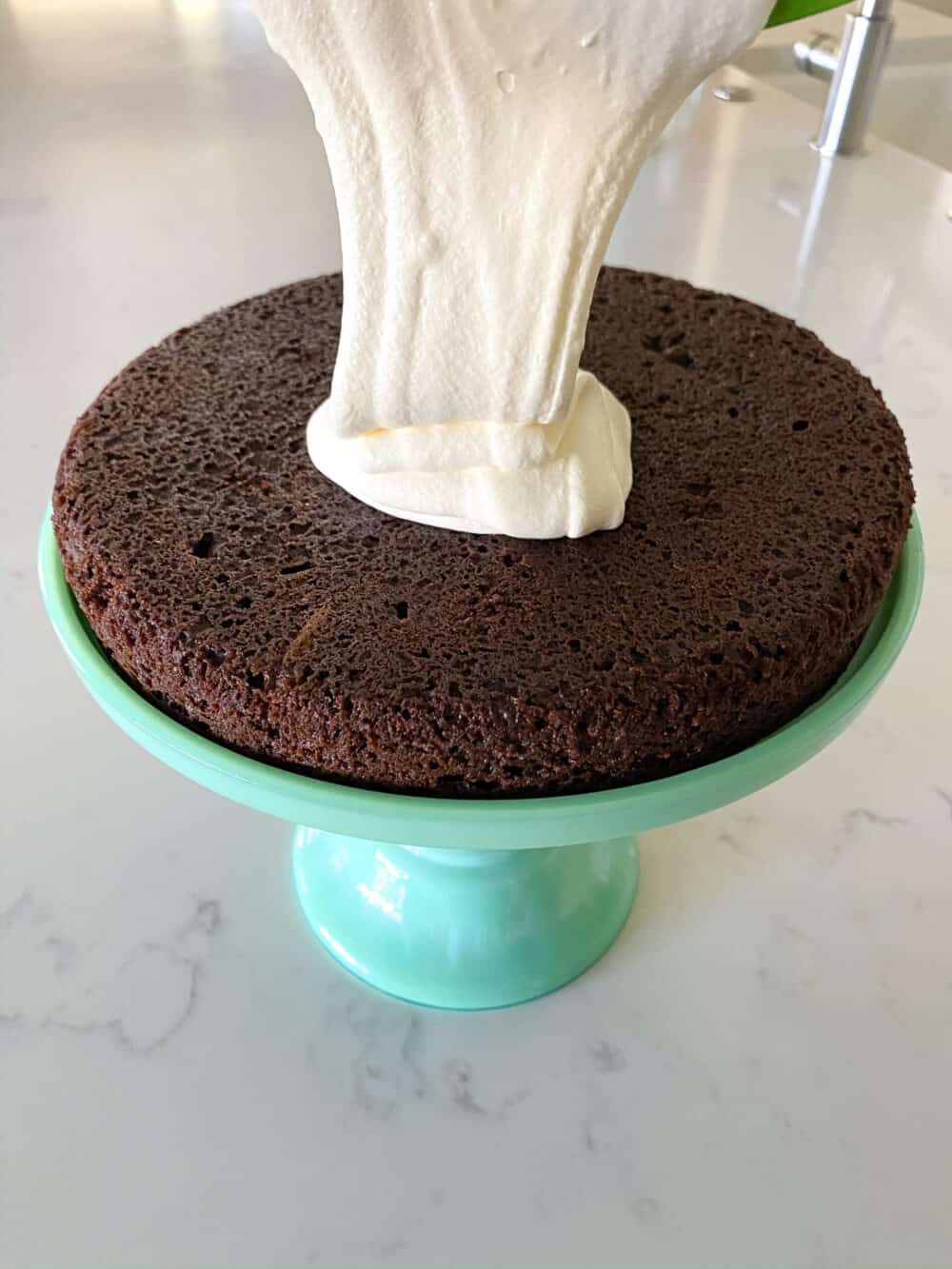 top first cake layer with ding dong cake filling