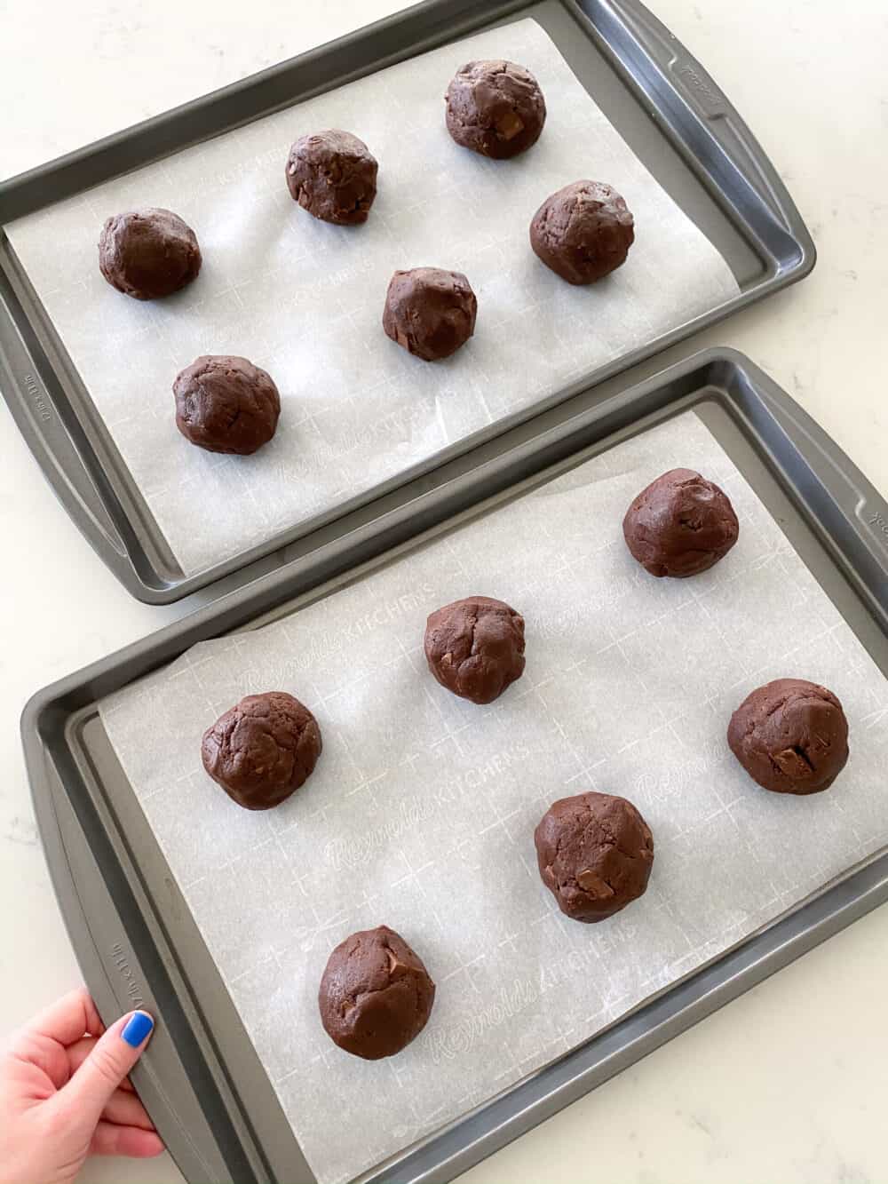 double chocolate chip cookie dough rounds on baking sheet