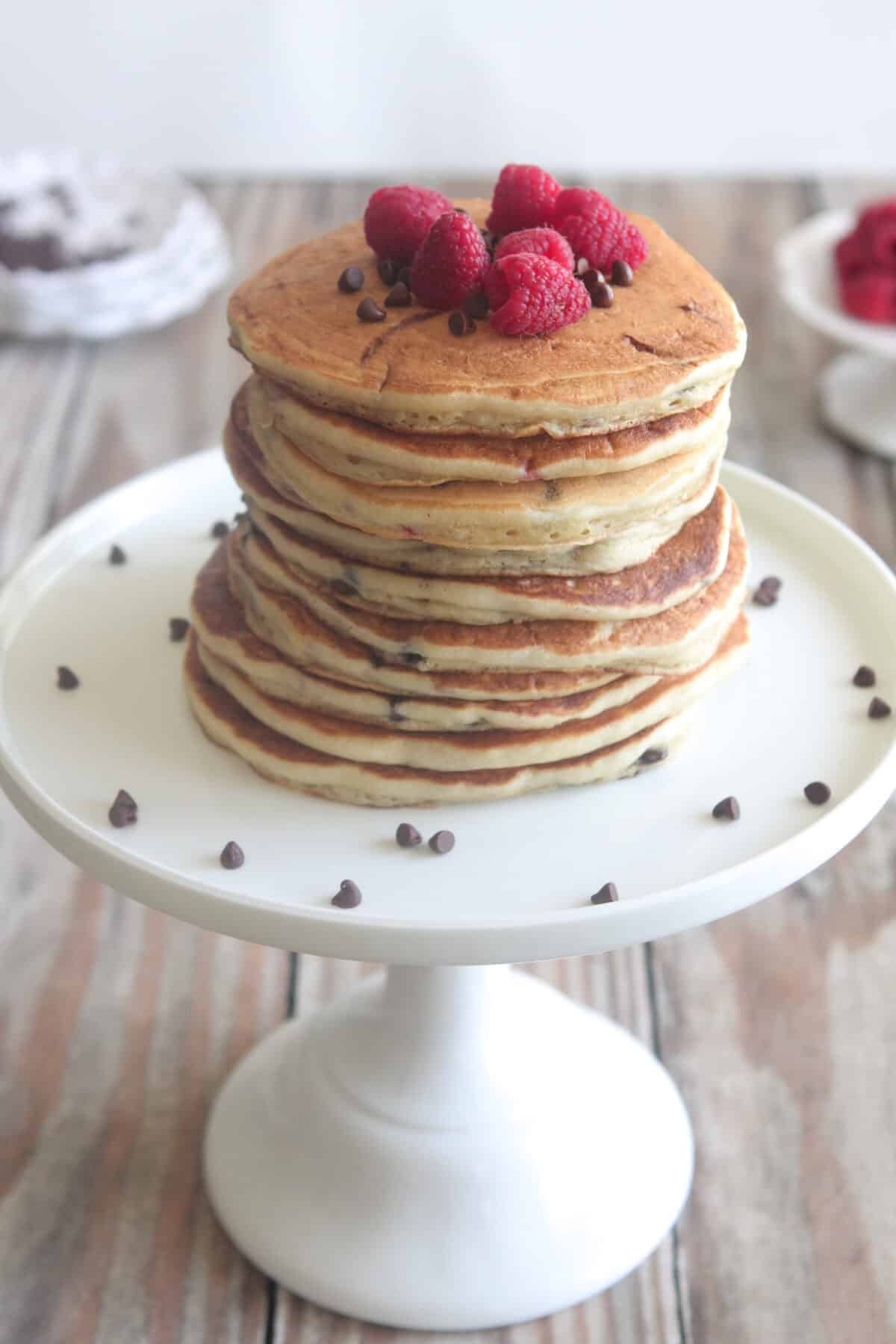 stack of raspberry chocolate chip pancakes on cake stand