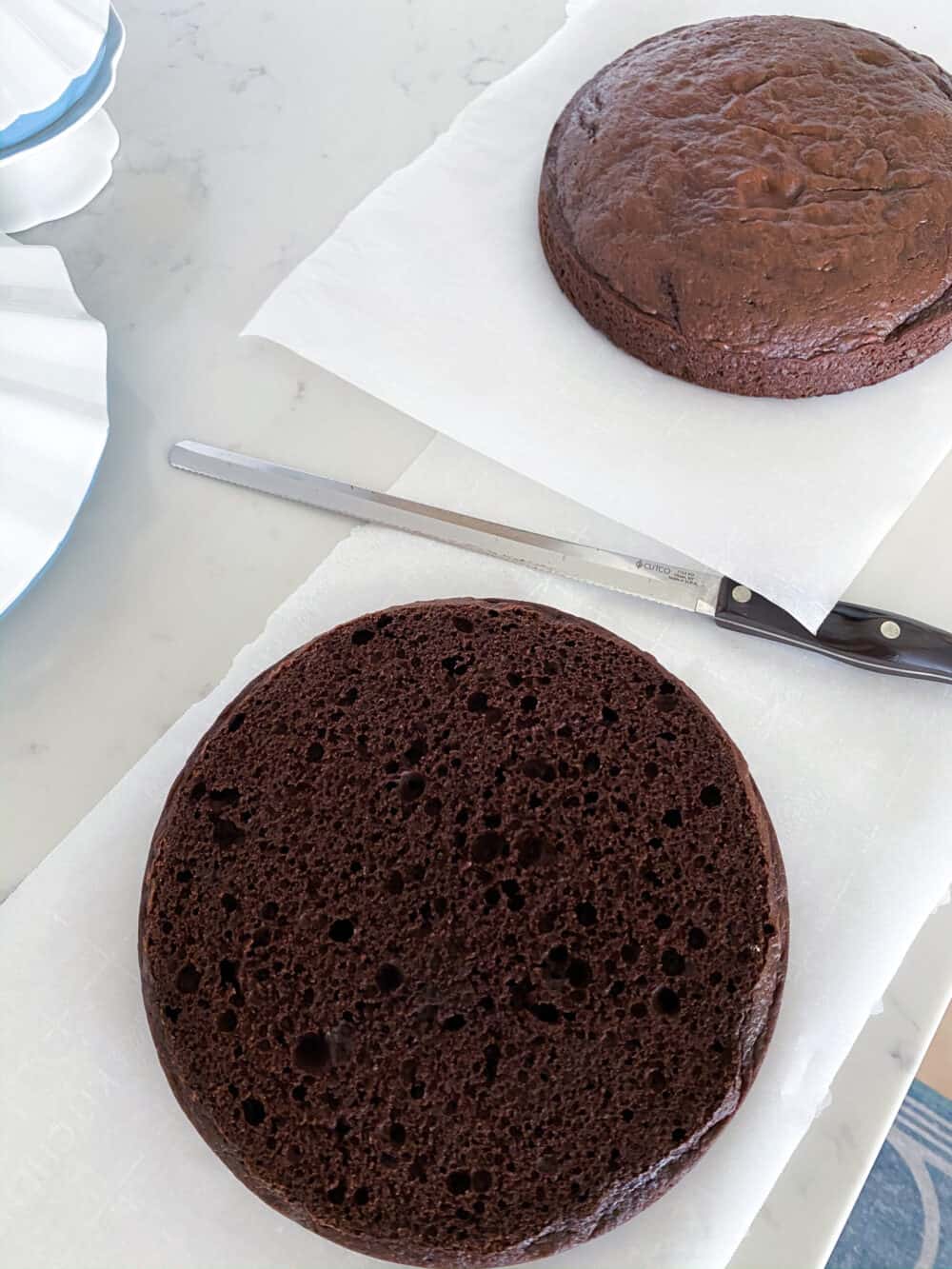 trimming baked cake tops off before frosting