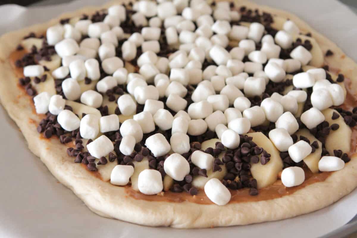 mini marshmallows layered on top of dessert pizza