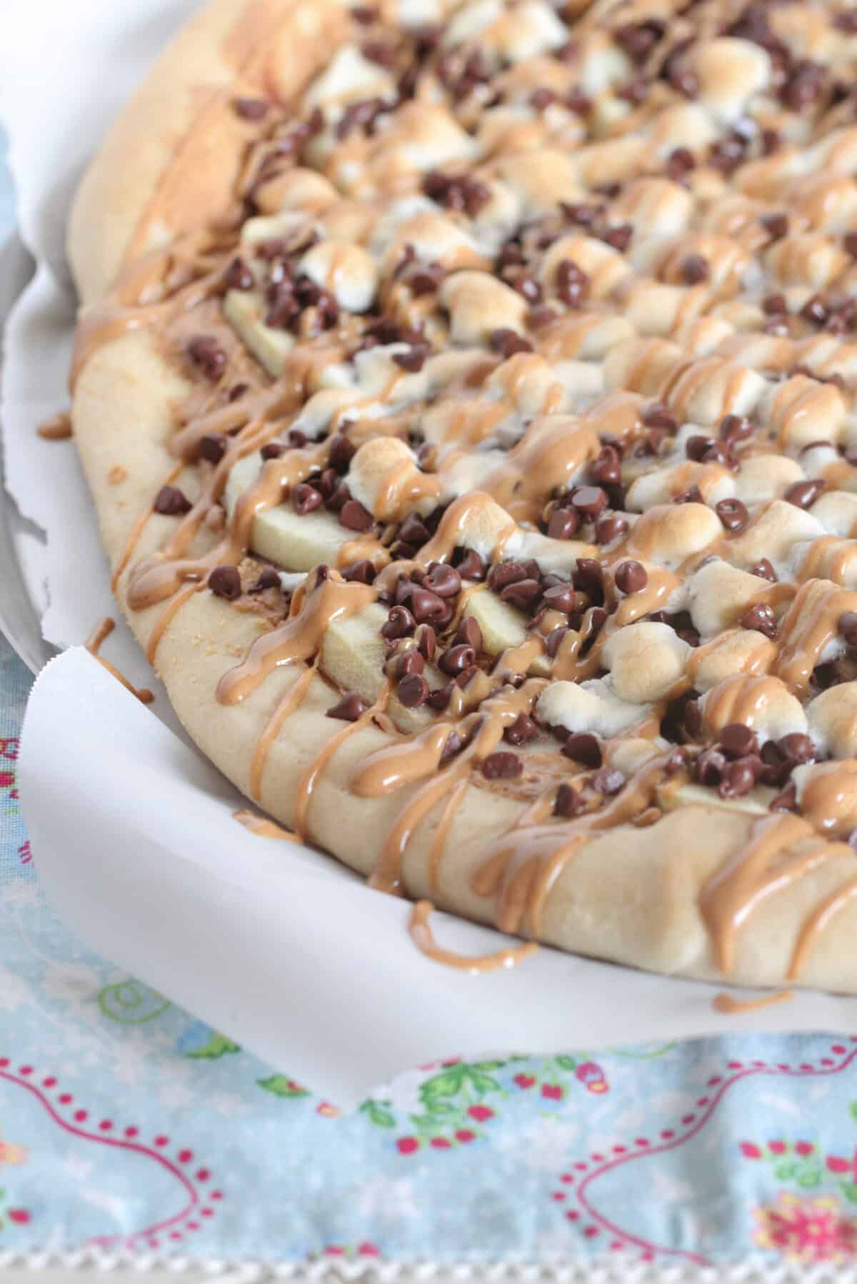 dessert pizza on a pizza pan ready to serve