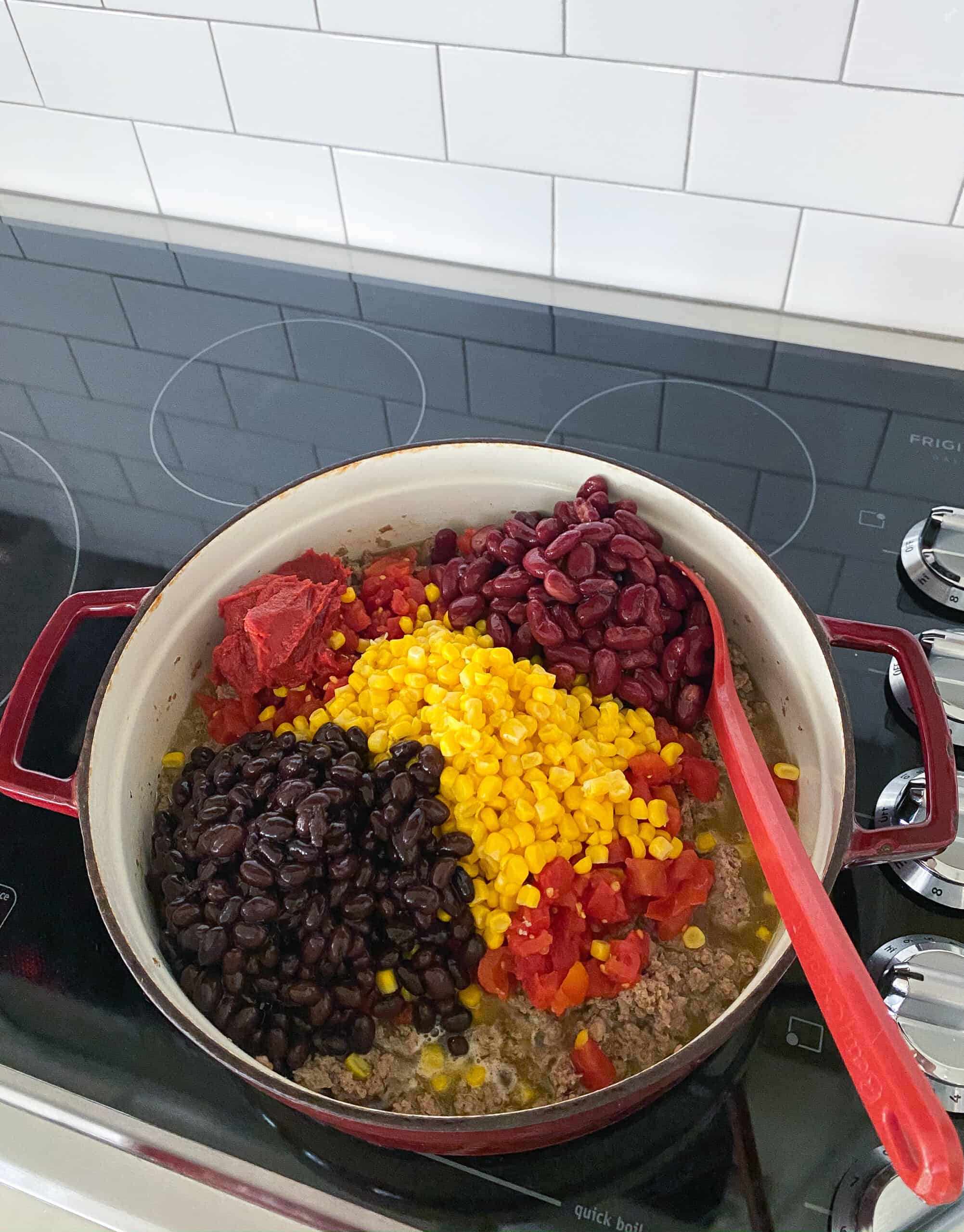 add corn, tomatoes, beans and tomato paste to pot