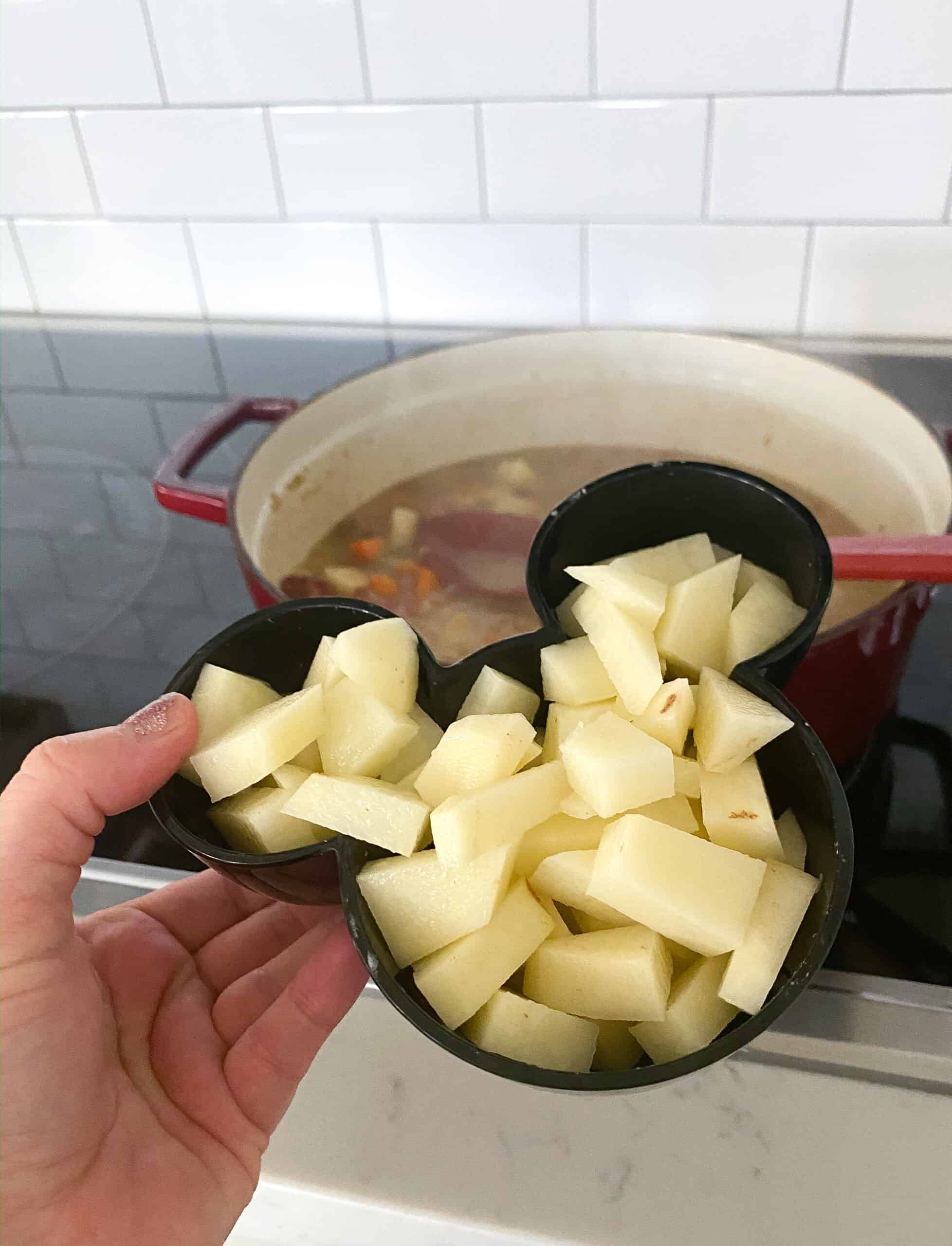 adding potatoes for loaded baked potato soup