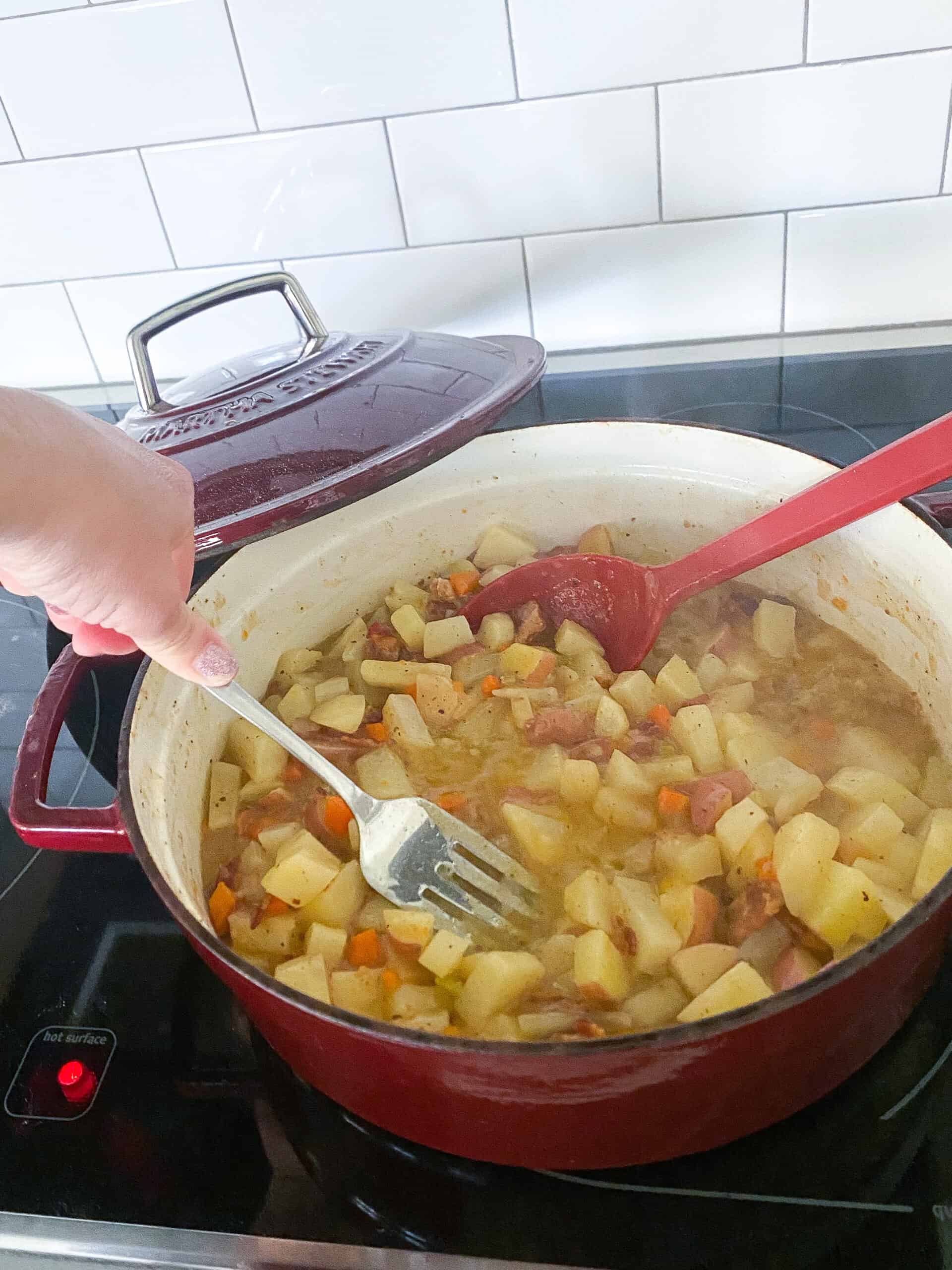 mashing potatoes for loaded baked potato soup