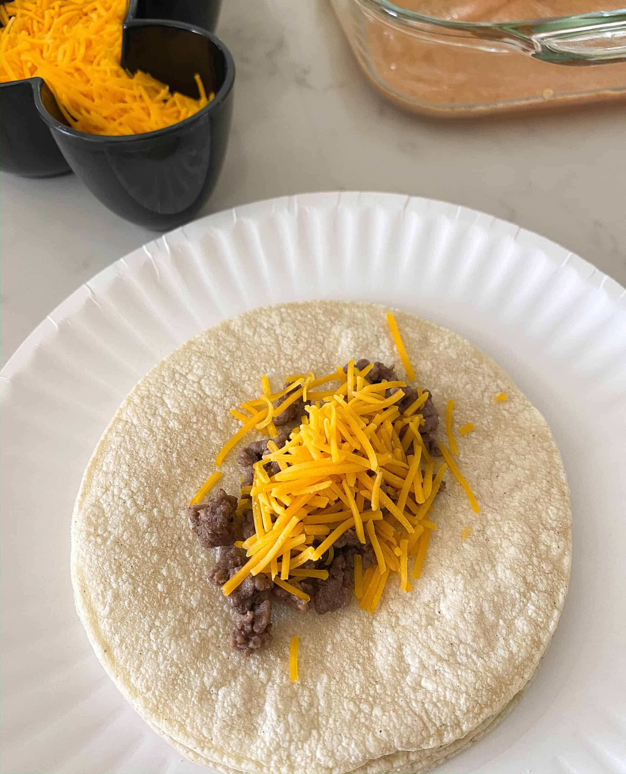 beef and cheese on center of tortillas