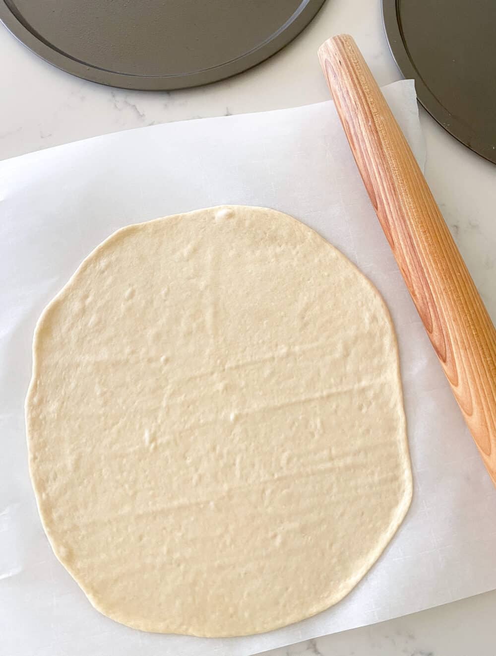 rolling pizza dough into rounds